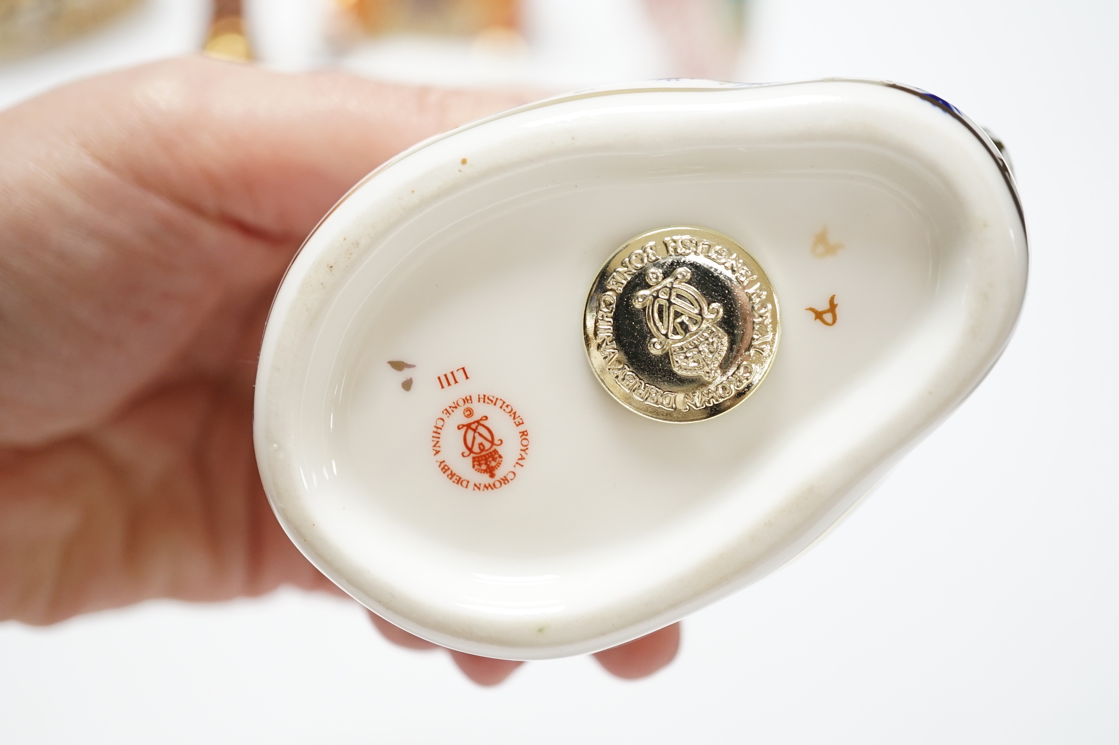 A collection of five Royal Crown Derby animal and bird paperweights